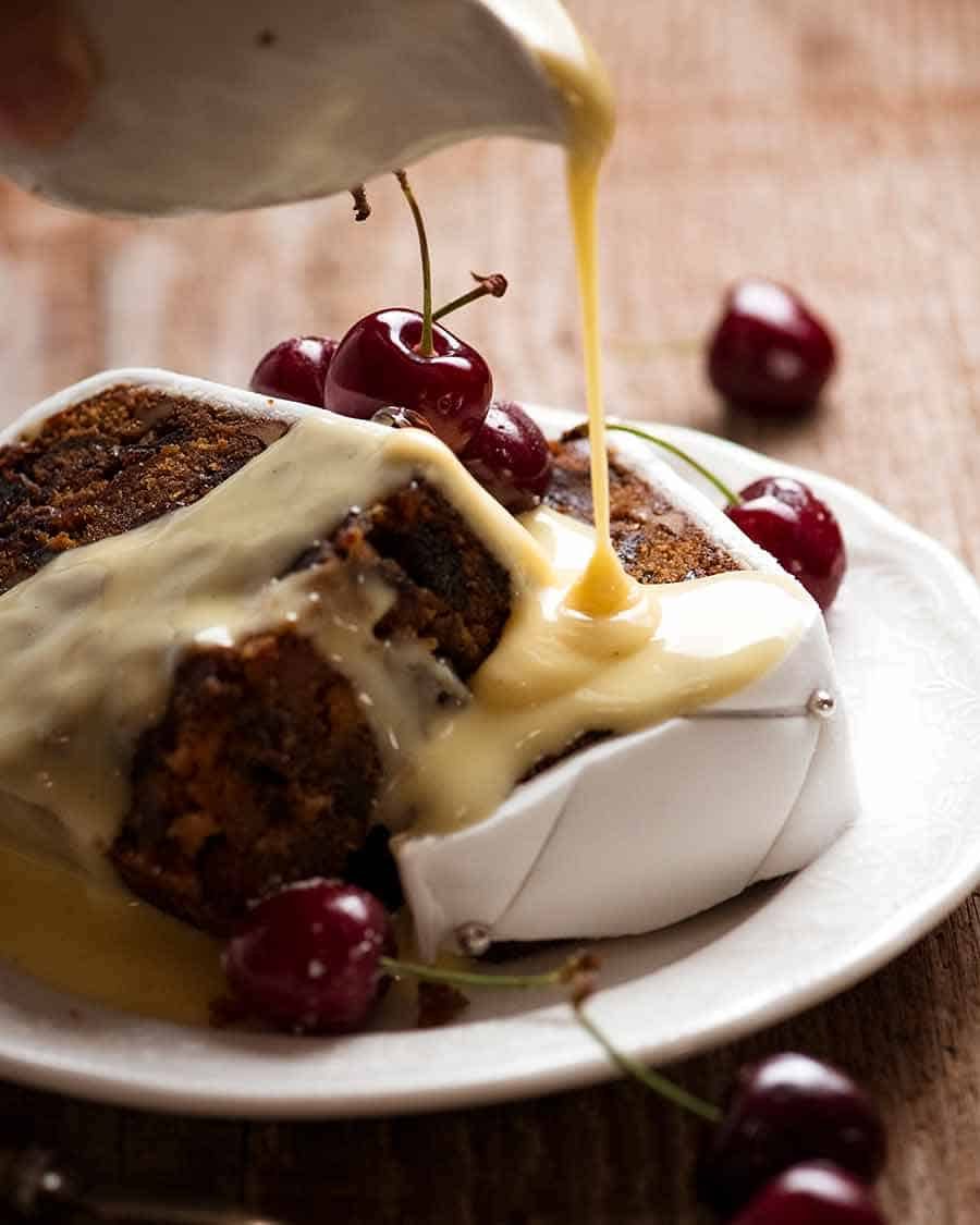 pouring-custard-over-christmas-cake Pouring custard over Christmas Cake