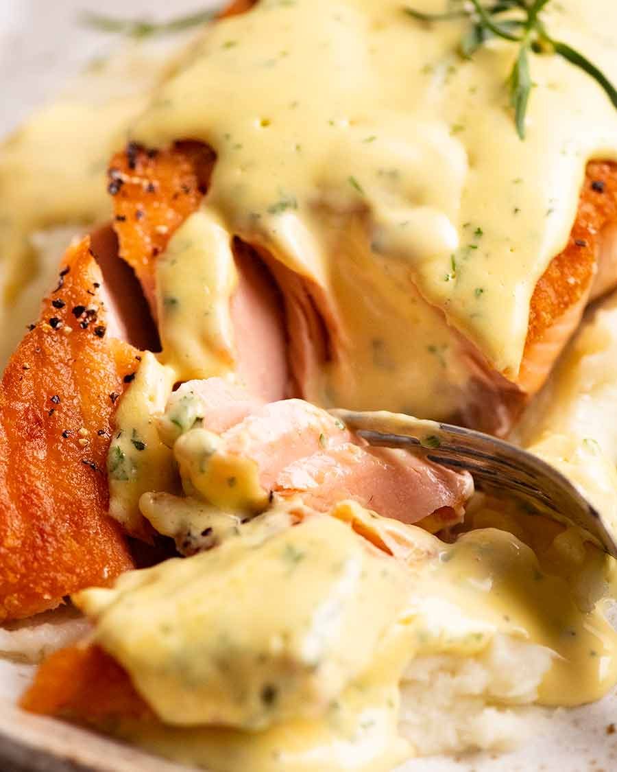 salmon-with-bearnaise-sauce-3 Close up of fork cutting into salmon with Bearnaise Sauce
