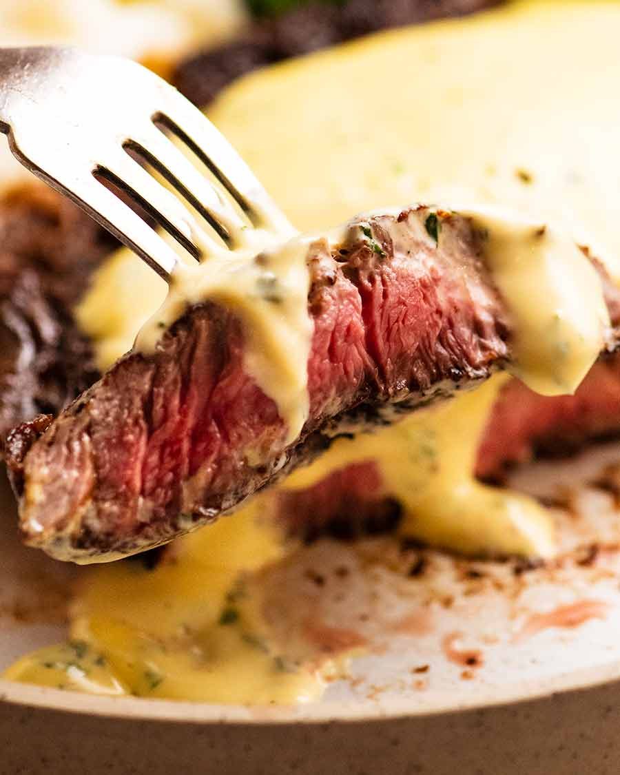 steak-with-bearnaise-sauce-2 Close up of fork picking up a slice of steak with Bearnaise Sauce