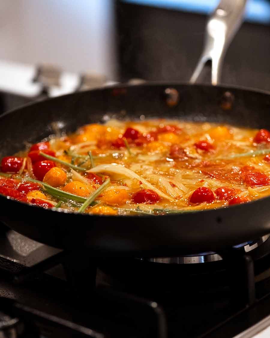 acqua-pazza-sauce Sauce for Acqua Pazza - Italian Poached Fish, simmering on the stove.