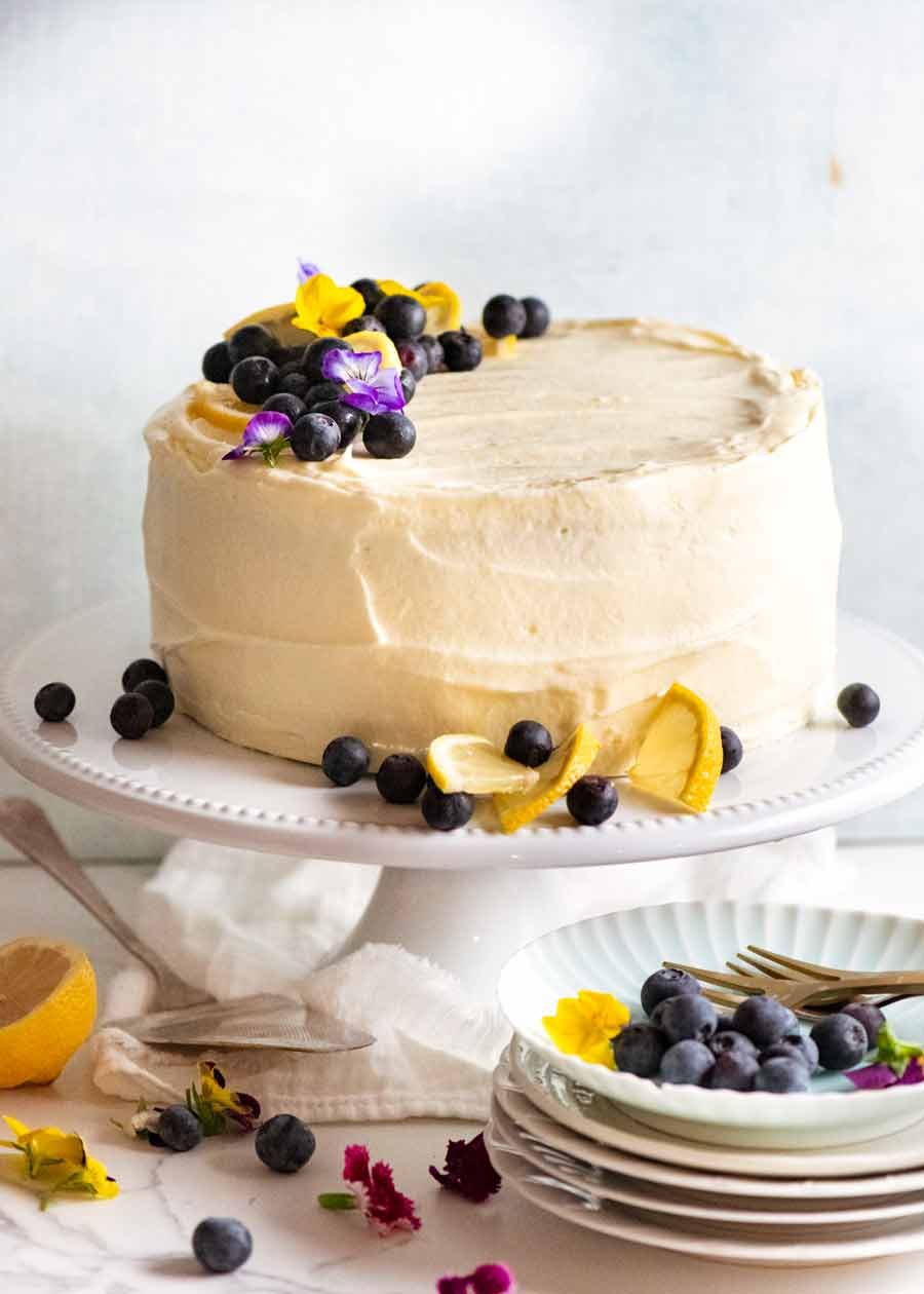 blueberry-cake-with-lemon-cream-cheese-frosting_2 Blueberry Cake with Lemon Cream Cheese Frosting on a cake stand, ready to be served