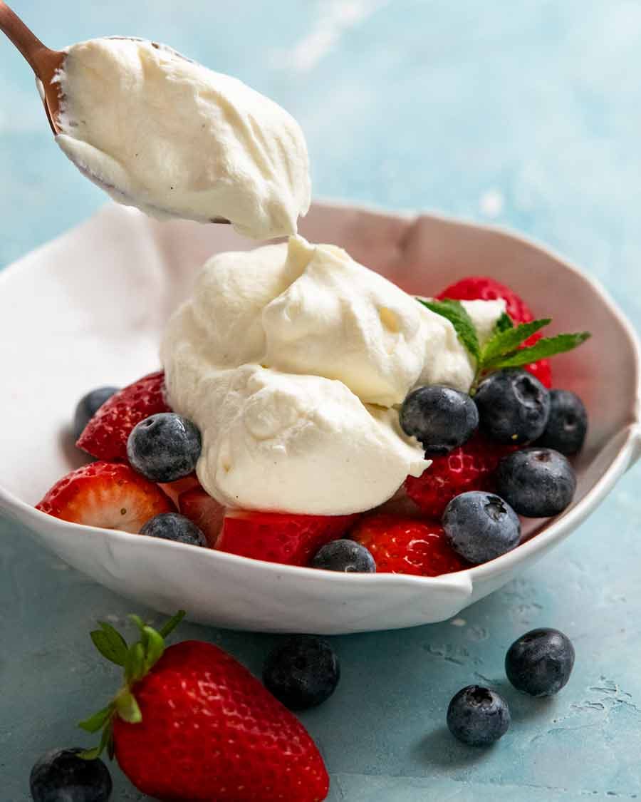 chantilly-cream_3 Chantilly cream - French whipped cream dollop on a bowl of fruit