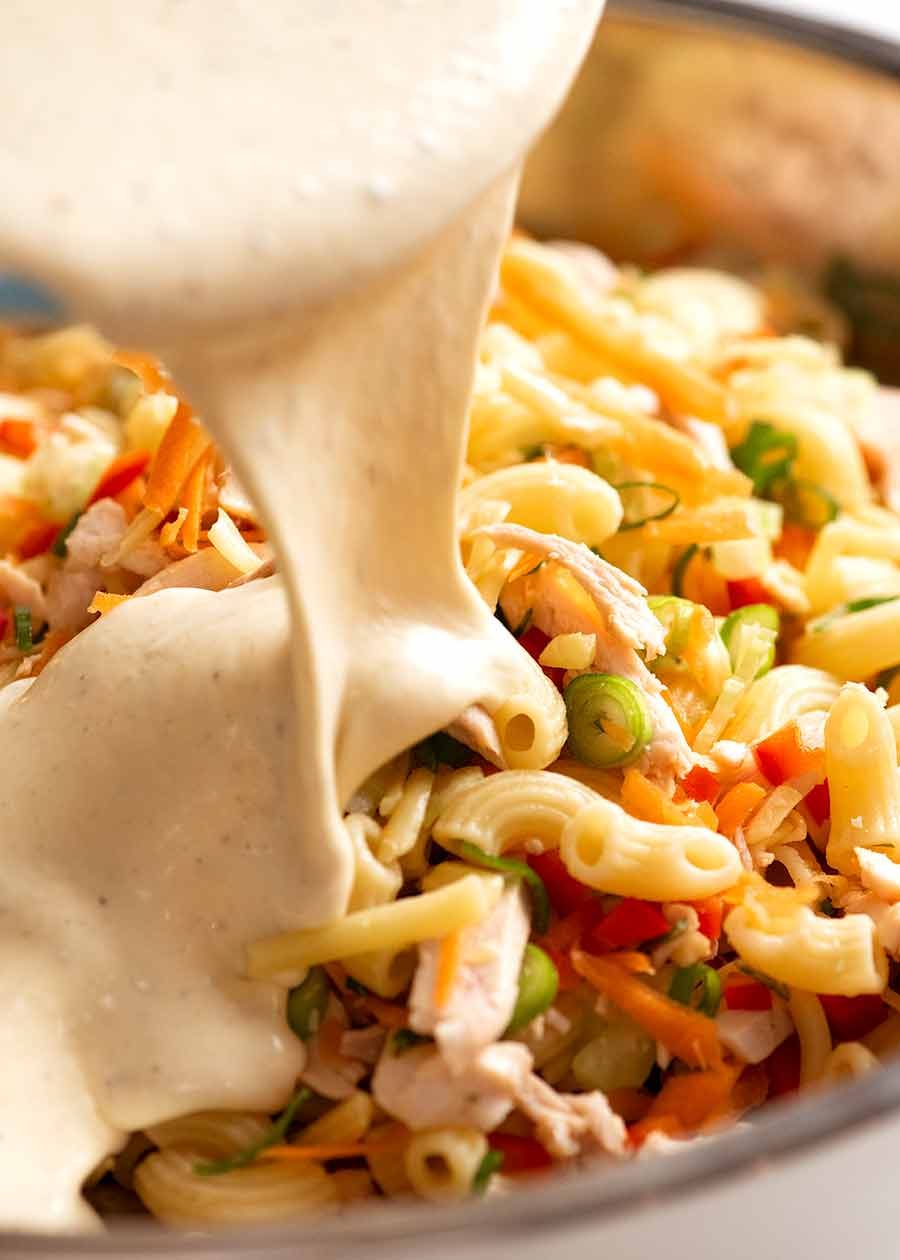 creamy-chicken-pasta-salad_1 Creamy Dressing being poured over Chicken Pasta Salad