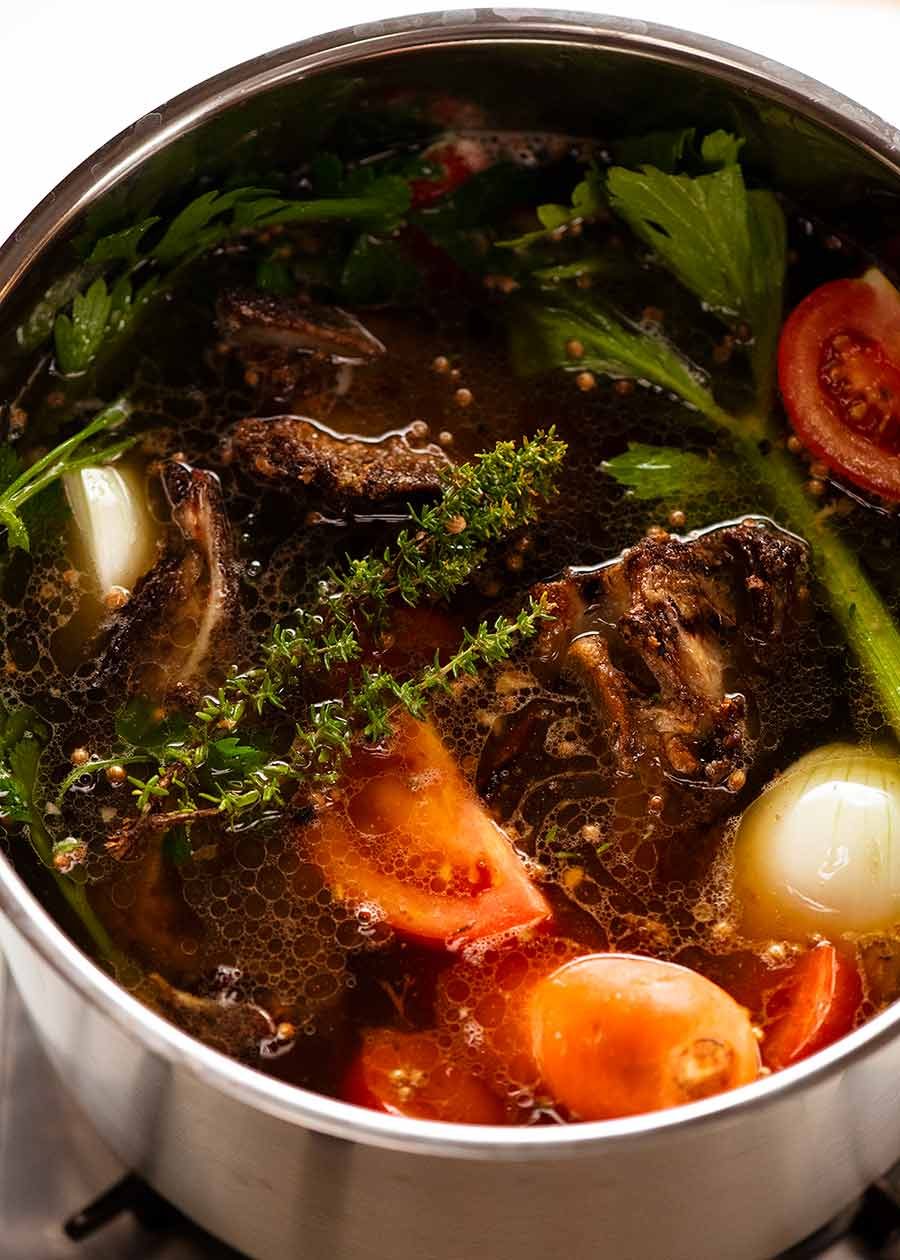 homemade-beef-stock_7 Pot of beef stock simmering