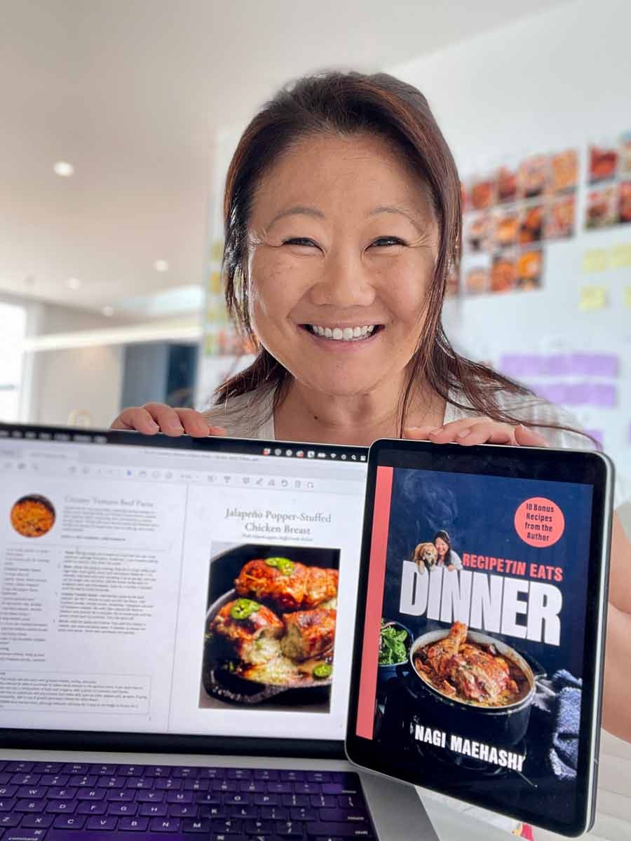 nagi-free-bonus-north-america-recipe-book Nagi Maehashi holding the free bonus recipe book for "Dinner" cookbook early buyers