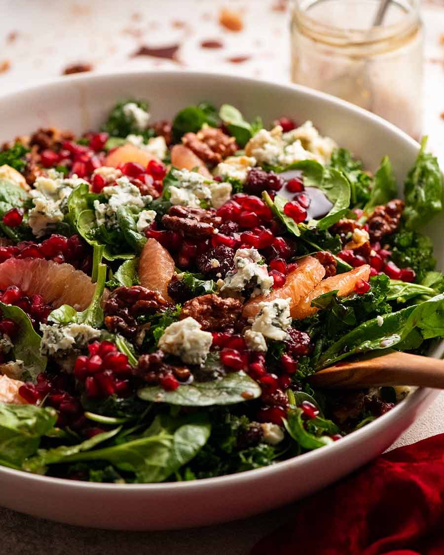 pomegranate-salad-kale-spinach_6 Close up side photo of Pomegranate Salad in a bowl, ready to be served