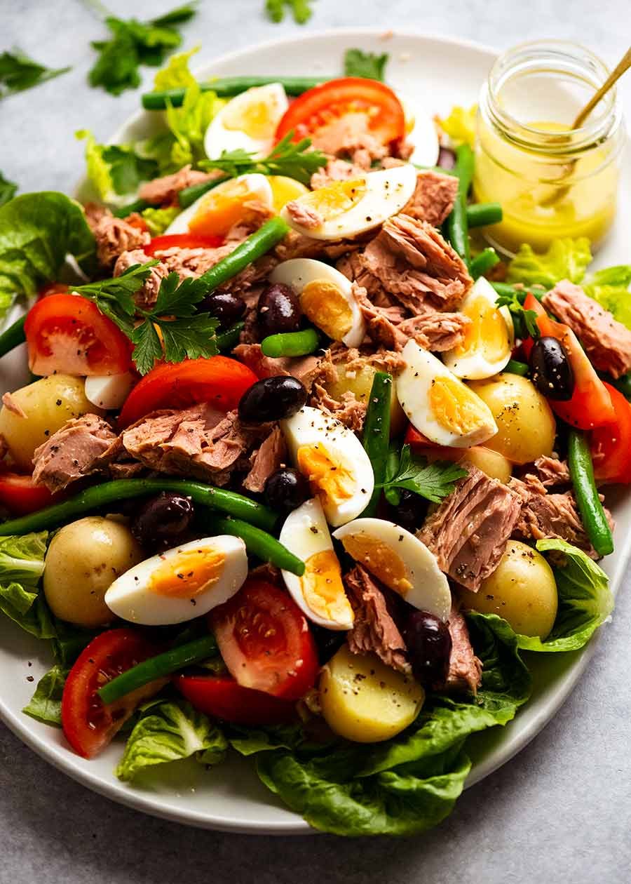 salade-nicoise-v2_3 Platter piled high with Salad Nicoise - French Tuna Salad, ready to be served