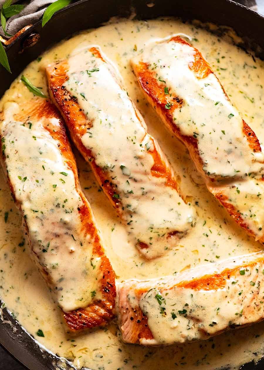 salmon-in-creamy-herb-garlic-sauce_5 Creamy Herb & Garlic Salmon Sauce in a skillet, fresh off the stove, ready to be served