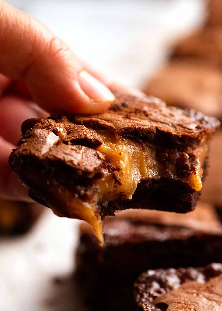 salted-caramel-stuffed-brownies_9 Hand holding Caramel Brownies