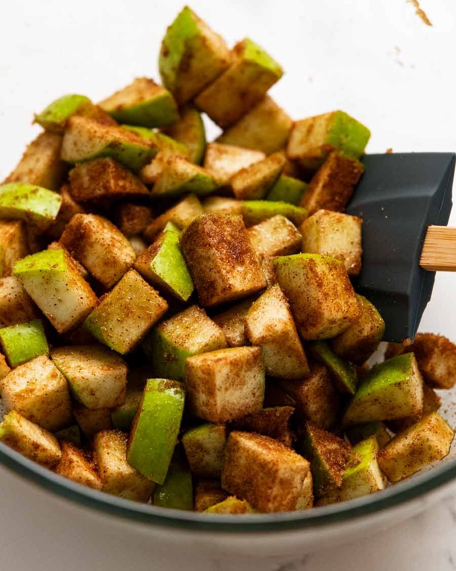 apple-tossed-in-cinnamon Tossing apples in cinnamon for Cinnamon Apple Bread
