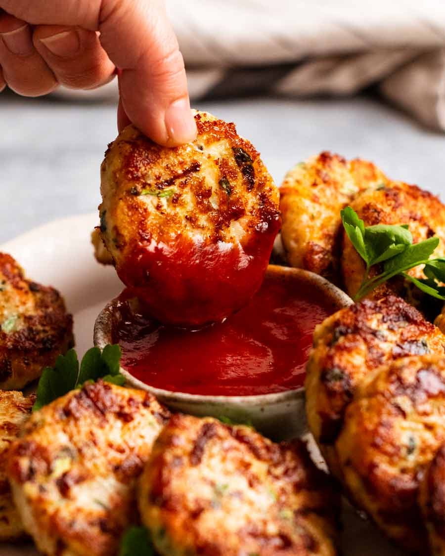 chicken-rissoles_2 Dipping a chicken rissole in ketchup