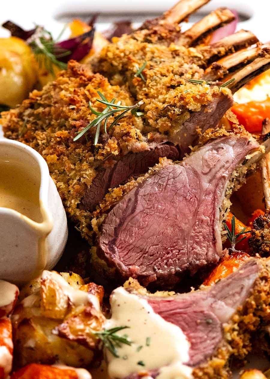 crumbed-rack-of-lamb_7 Rosemary Crumbed Rack of Lamb on a platter with roasted vegetables