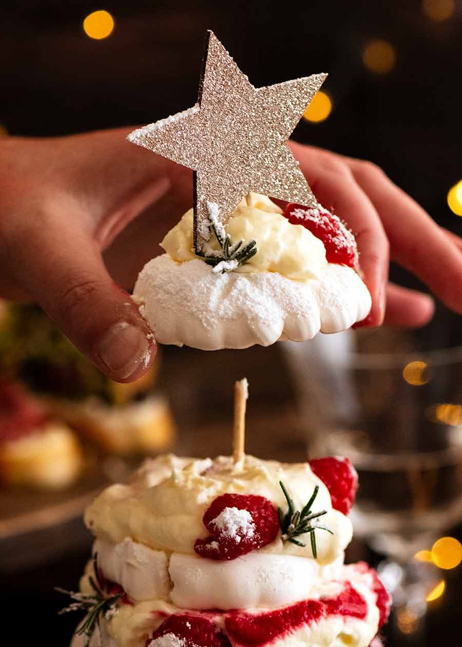 pavlova-christmas-tree_8 Handing picking up top layer of Pavlova Christmas Tree Dessert