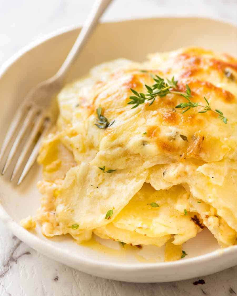 potatoes-au-gratin_1 Close up of bowl with Potatoes au gratin (Dauphinoise Potatoes), ready to be eaten