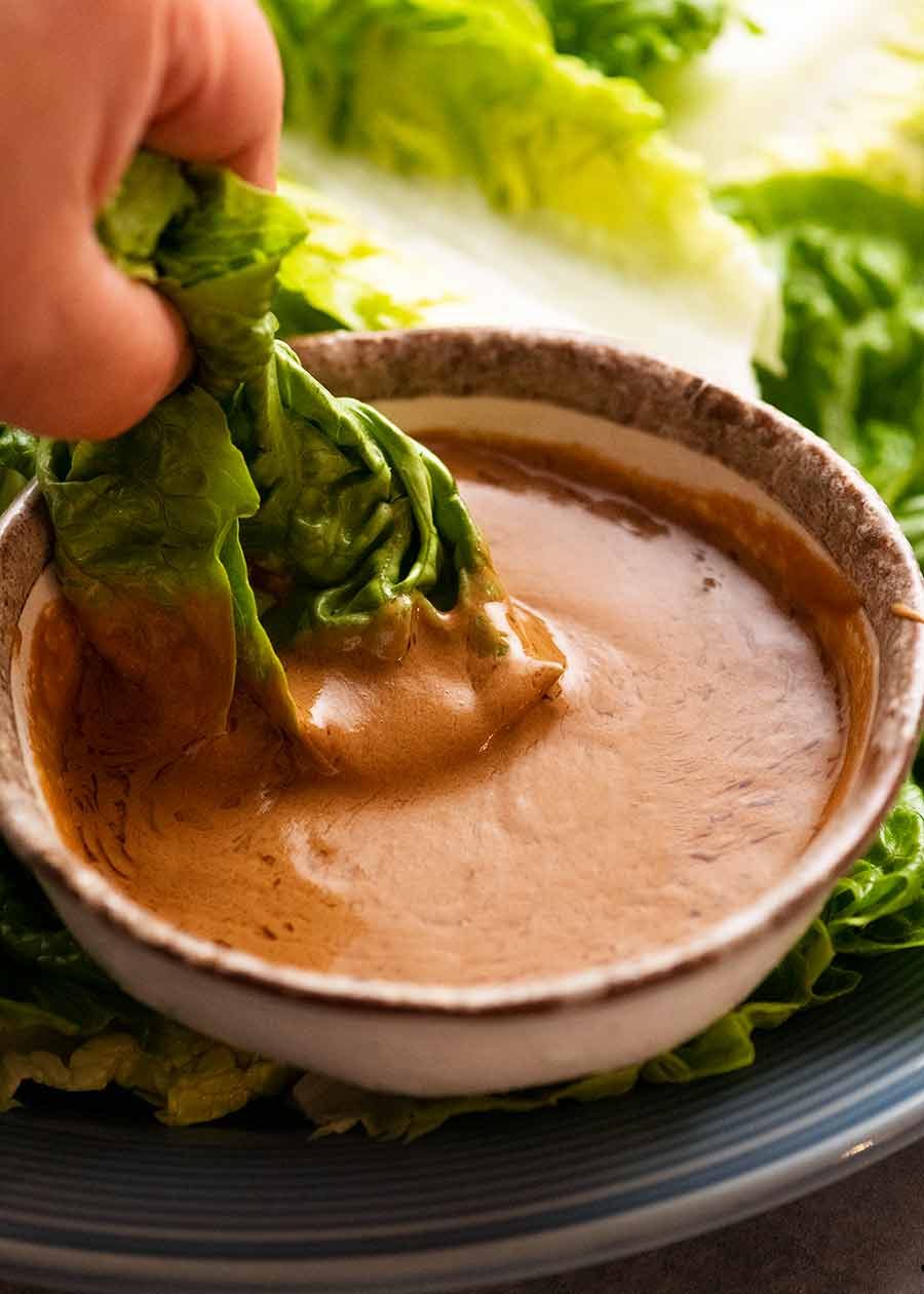 chinese-peanut-sesame-sauce-for-lettuce_6 Dipping lettuce into Creamy Sesame Sauce