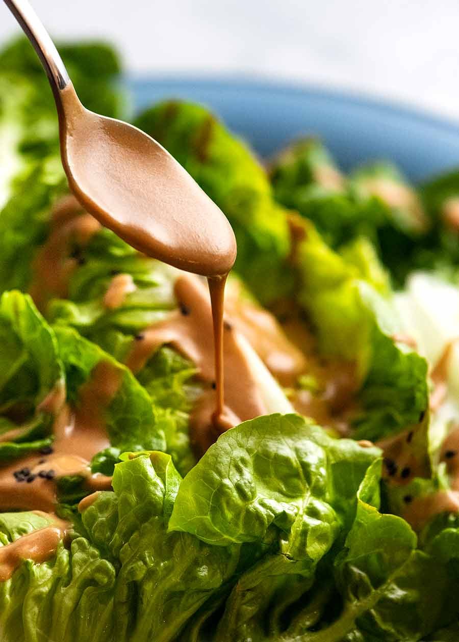chinese-peanut-sesame-sauce-for-lettuce_8 Drizzling creamy Sesame Sauce over lettuce for Spicy Joint Creamy Sesame Sauce Lettuce Salad
