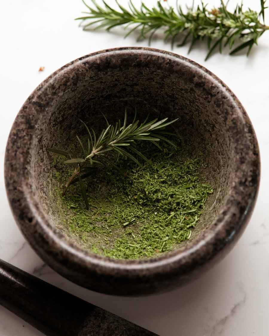 grinding-rosemary Grinding rosemary for rosemary salt
