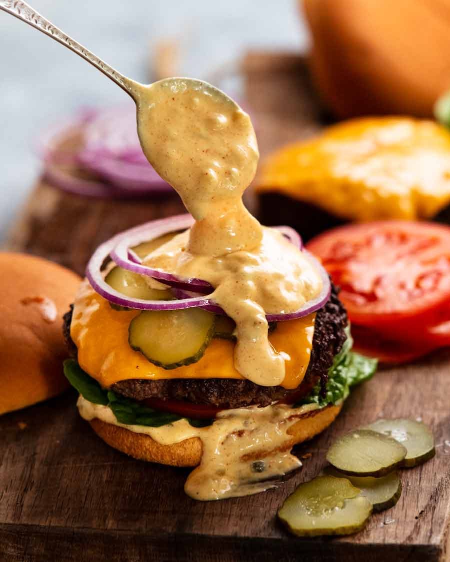 special-burger-sauce_1 Spooning Special burger sauce onto a cheeseburger