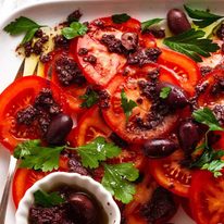 tomato-with-olive-tapenade_5-sq Close up overhead photo of Tomato Salad with Olive Tapenade