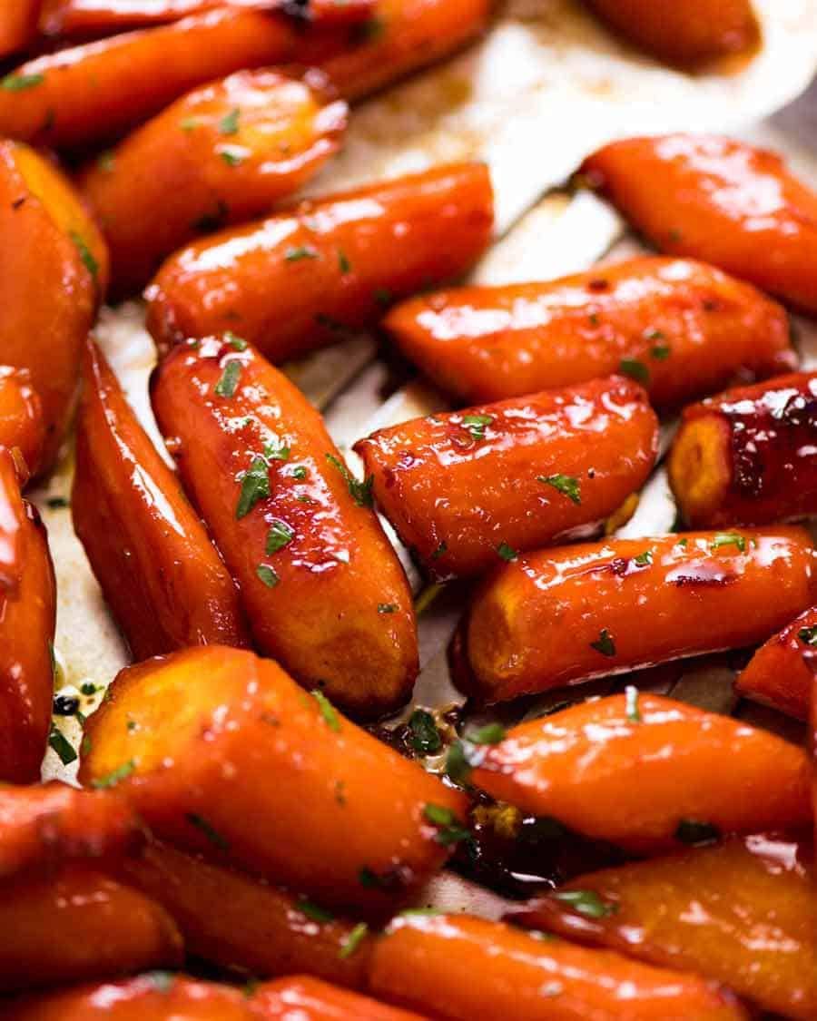 brown-sugar-roast-carrots_3-1 Close up of Brown Sugar Glazed Carrots on a tray, fresh out of the oven