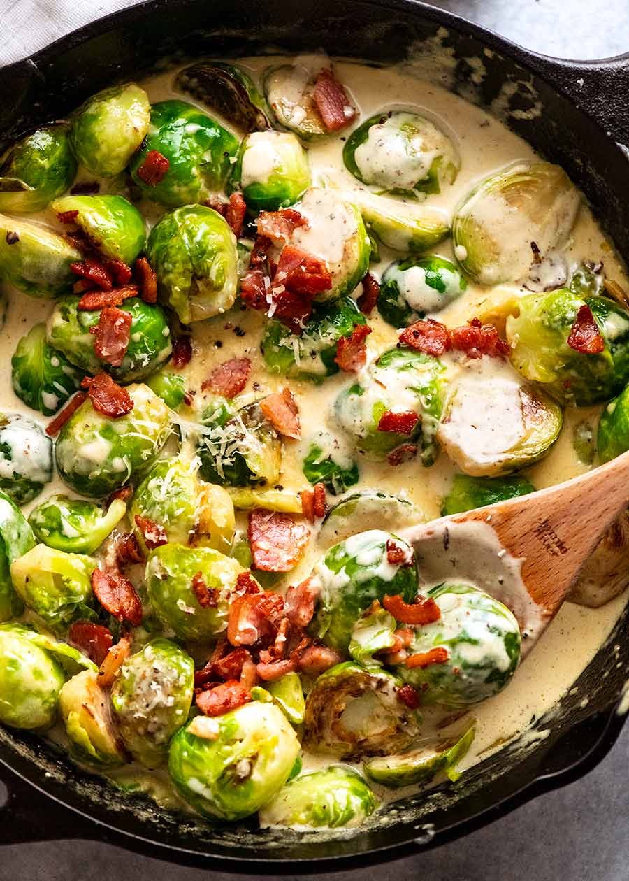 creamy-brussels-sprouts_4 Brussels Sprouts in a creamy sauce with bacon in a skillet, fresh off the stove