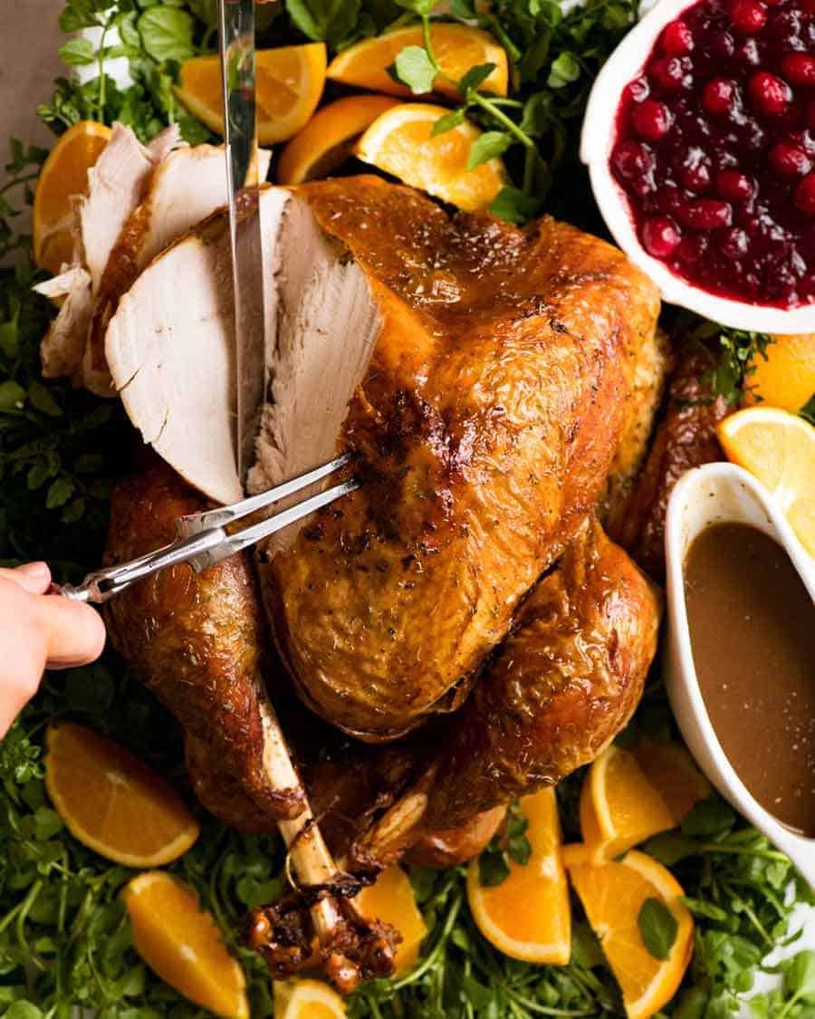 juicy-roast-turkey_dry-brined_2-1 Juicy Roast Turkey being carved, ready for serving