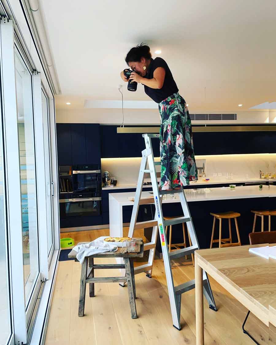 nagi-taking-photo-ladder Making the RecipeTin cookbook