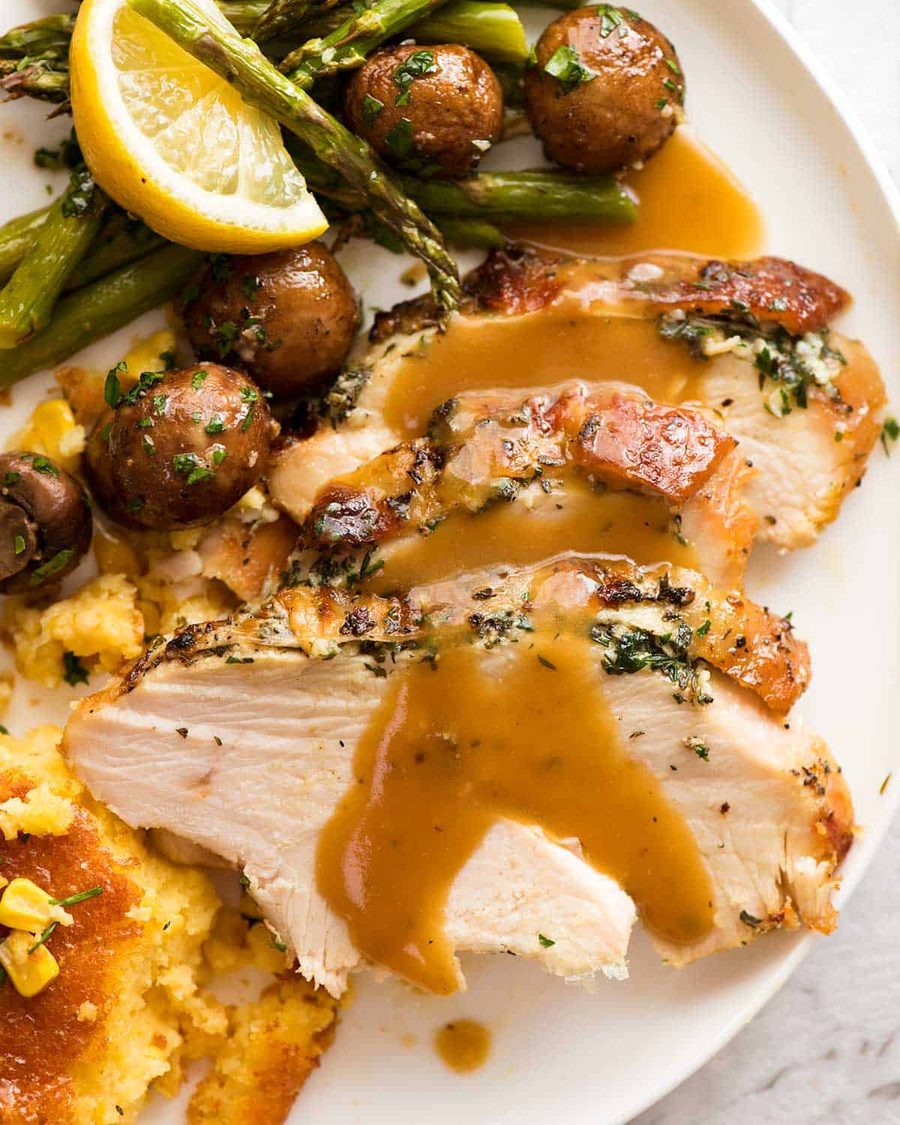 slow-cooker-garlic-herb-turkey-breast_thanksgiving-dinner-plate Slow Cooker Garlic Herb Turkey Breast dinner plate with creamy corn casserole, roasted mushrooms, and lemon garlic asparagus