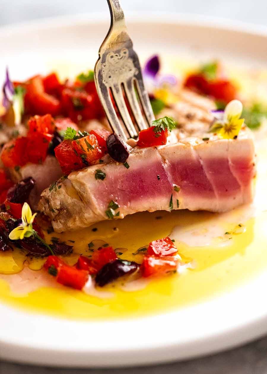 tuna-steak-main_2 Close up of fork picking up a slice of tuna steak