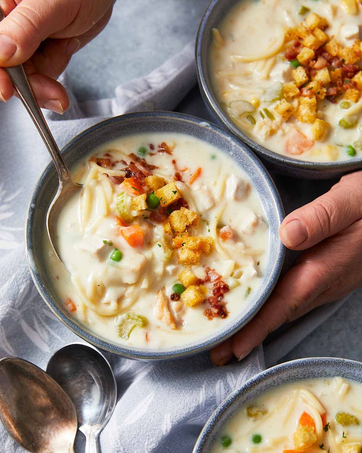 chicken-noodle-soup-51341 Creamy chicken noodle soup in bowls