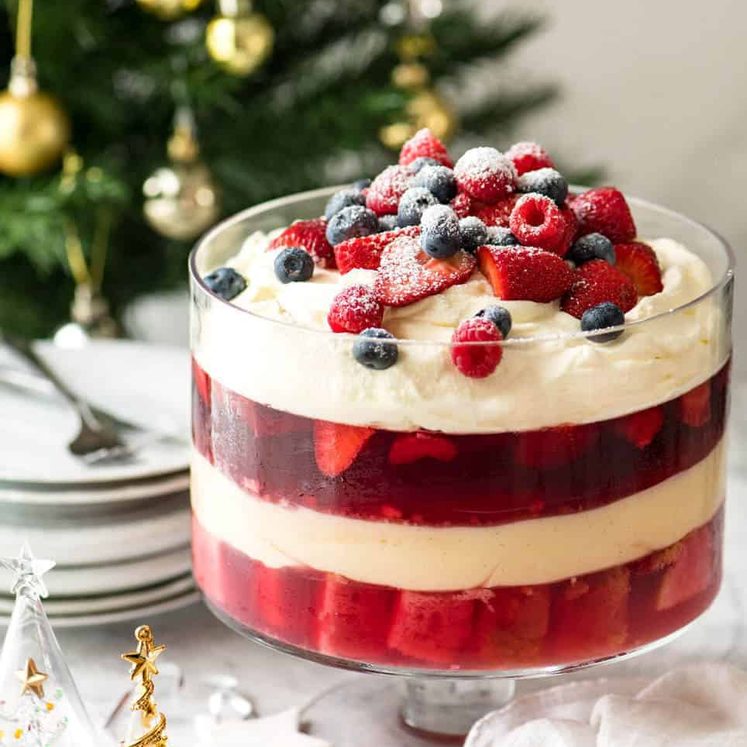 christmas-trifle-3 Layers of Cranberry Jelly and custard, and piled high with whipped cream and fruit, this Christmas Trifle will brighten any table! recipetineats.com