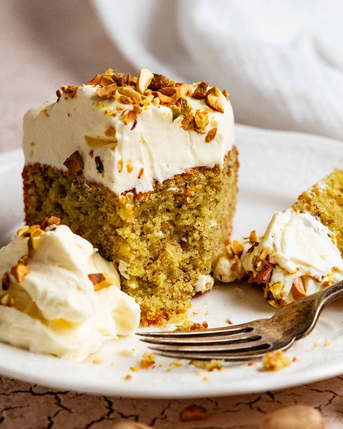 pistachio-cake_8-3 Eating slice of Pistachio cake