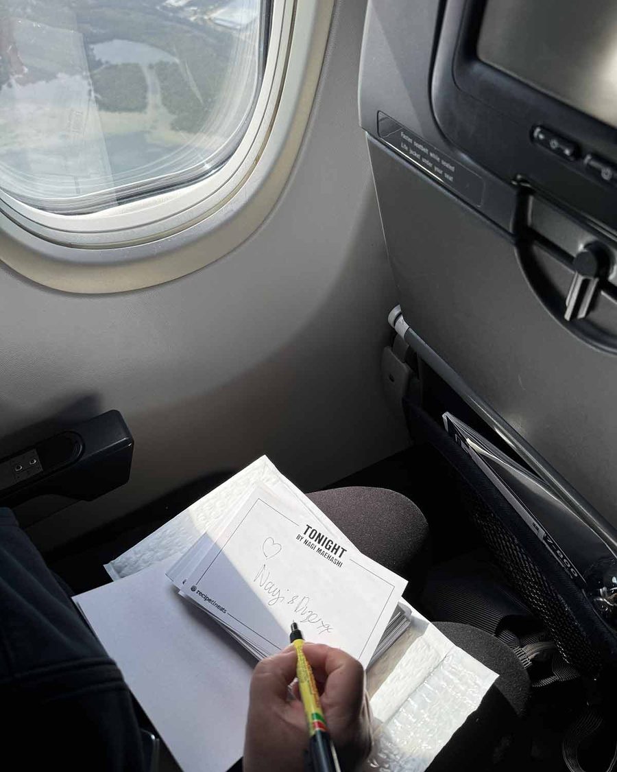 signing-nagi-dozer-bookplates-on-plane