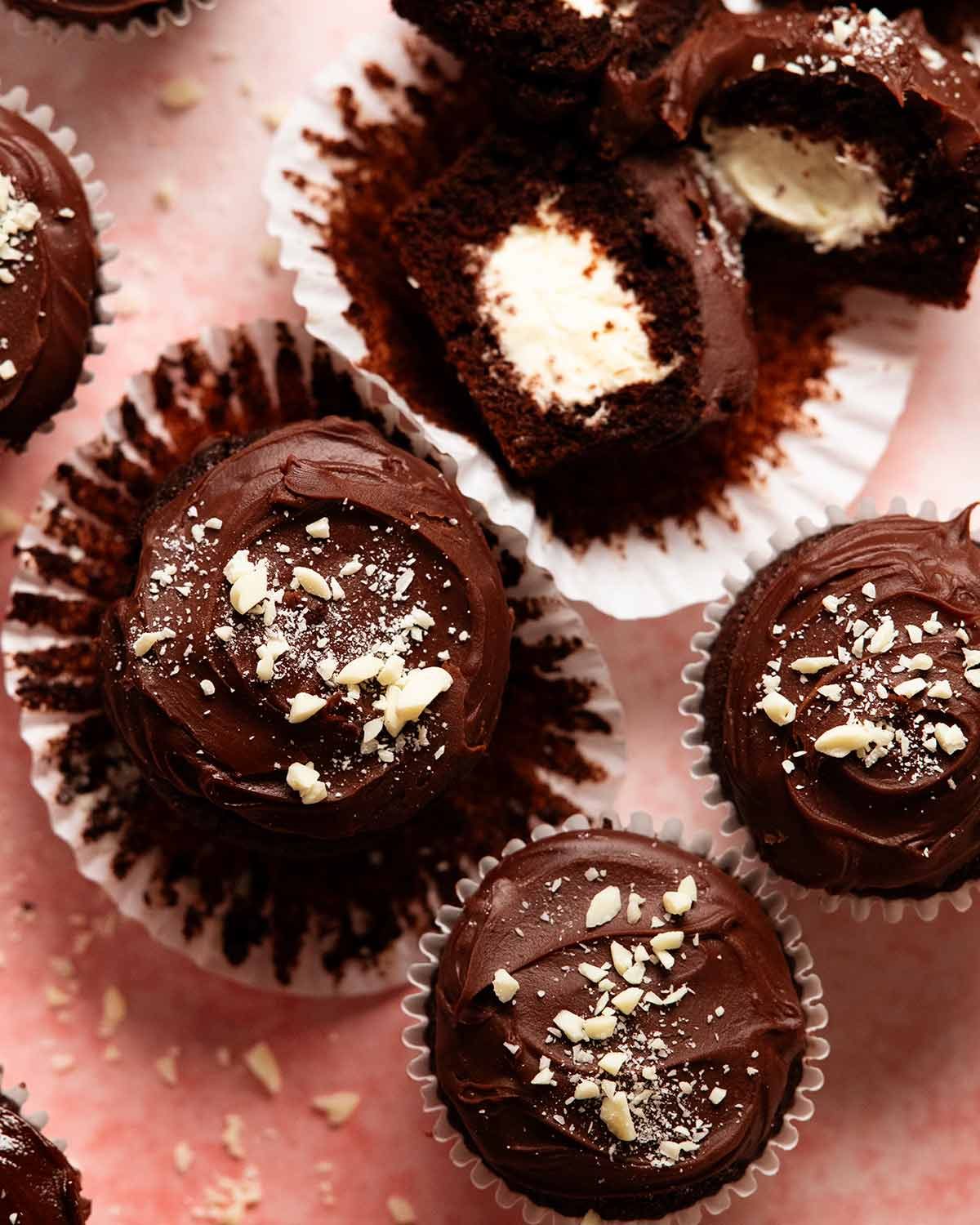 Whipped vanilla cream filled chocolate cupcakes with ganache frosting
